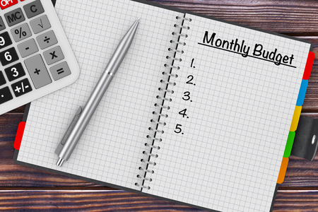 home budget planning sheet with pen and calculator stock photo
