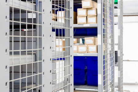 stock photo storage bins and industrial storage racks in a warehouse shot with shallow focus - Industrial Storage Bins stock photo storage bins and industrial storage racks in a warehouse shot with shallow focus - Industrial Storage Bins
