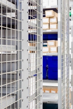 stock photo storage bins and industrial storage racks in a warehouse shot with shallow focus - Industrial Storage Bins stock photo storage bins and industrial storage racks in a warehouse shot with shallow focus - Industrial Storage Bins
