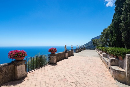 Ravello, Villa Cimbrone in a sunny summer day, infinite terrace and statues over the Amalfi Coast coastline.