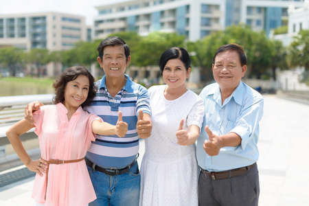 Group of Vietnamese senior people showing thumbs-up Stock Photo - 73168161