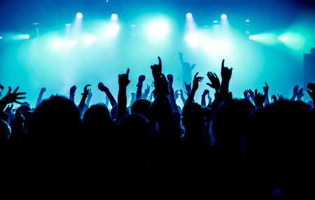 27732838-silhouettes-of-concert-crowd-in-front-of-bright-stage-lights.jpg