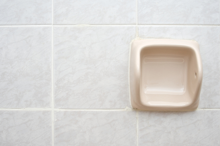 empty cream tissue holder on right of the bathroom wall. stock empty cream tissue holder on right of the bathroom wall. stock