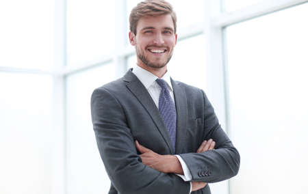 Close Up Serious Young Businessman Standing In Office Stock Photo