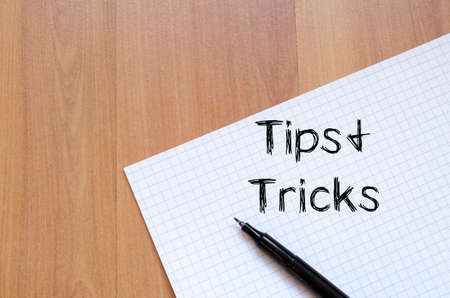 tips and tricks text concept write on notebook with pen stock photo