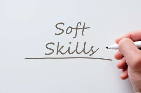 human hand writing soft skills on whiteboard stock photo picture