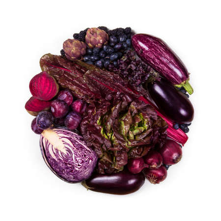 circle of purple and blue fruits and vegetables isolated on a