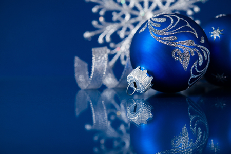 blue and silver christmas ornaments on dark blue xmas background with space for text stock photo - Blue And Silver Christmas Ornaments blue and silver christmas ornaments on dark blue xmas background with space for text stock photo - Blue And Silver Christmas Ornaments