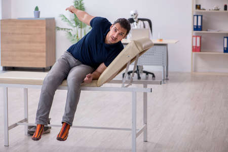 Young man visiting dead doctor