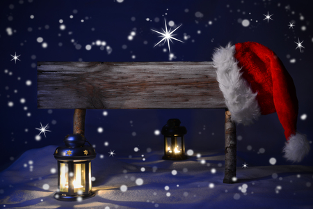stock photo wooden christmas sign and santa hat with snow in snowy scenery copy space free text for advertisement blue silent night with snowflakes and - Free Christmas Images To Copy stock photo wooden christmas sign and santa hat with snow in snowy scenery copy space free text for advertisement blue silent night with snowflakes and - Free Christmas Images To Copy