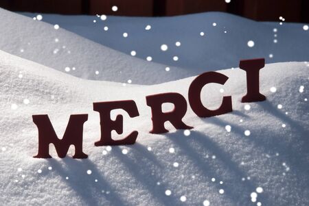 red letters on white snow with snowflakes as christmas card french text or word merci - What Does The Word Christmas Mean red letters on white snow with snowflakes as christmas card french text or word merci - What Does The Word Christmas Mean