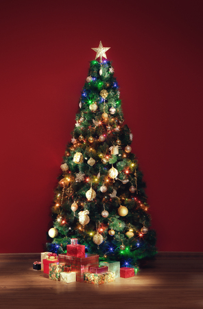 View of nice decorated christmas tree and some gift boxes indoor Stock Photo