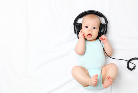funny baby little boy in headphones Stock Photo funny baby little boy in headphones Stock Photo - 55136892