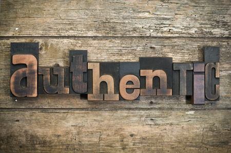 word "authentic" written with vintage letterpress printing blocks on rustic wood background - 43758235