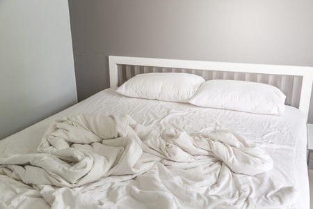 stock photo two white pillow on bed with wrinkle messy blanket in bedroom background - Bedroom Background stock photo two white pillow on bed with wrinkle messy blanket in bedroom background - Bedroom Background