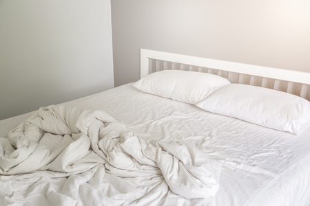 stock photo two white pillow on bed with wrinkle messy blanket in bedroom background - Bedroom Background stock photo two white pillow on bed with wrinkle messy blanket in bedroom background - Bedroom Background