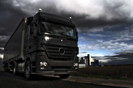 Truck in industrial landscape on dramatic HDR backgraound Stock Photo