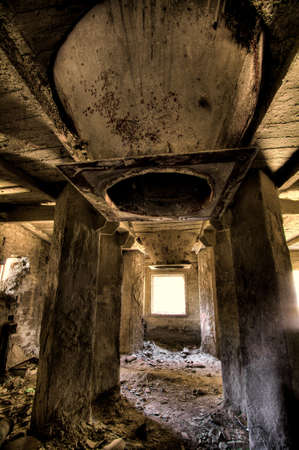 Empty industrial decayed room with large tube in the concrete wall  Stock Photo