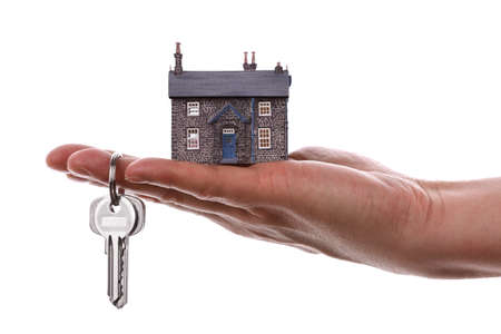 House Keys And Model Concept For Selling Or Moving Home Photo House Keys And Model Concept For Selling Or Moving Home Photo