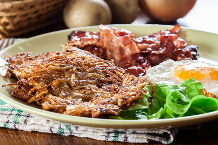 hash browns potato pancakes with crispy fried bacon and fried