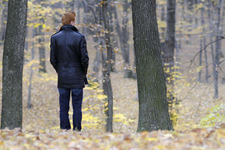 sad lonely: back of sad man suffering in fall season