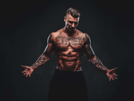 Portrait of man with tattooed chest and long hair  confident black  background  Stock Photo  147724901