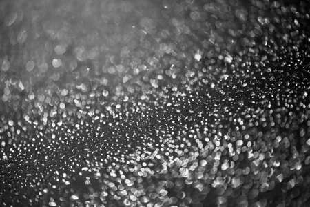 drops of rain on window with abstract lights rain drops on window