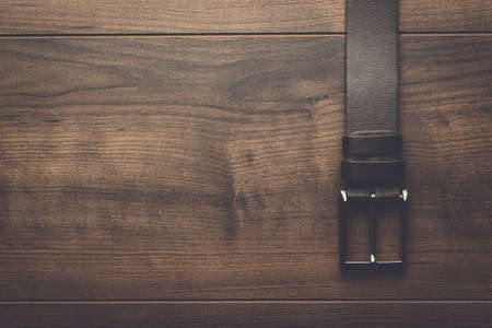 Brown Leather Belt For Men On Wooden Table Stock Photo Brown Leather Belt For Men On Wooden Table Stock Photo