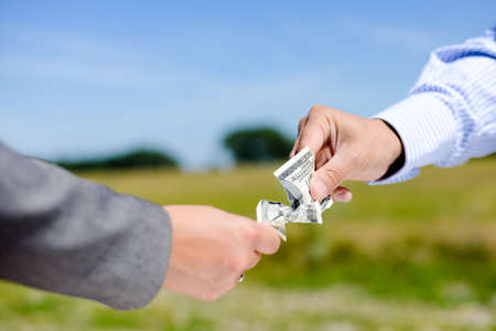 Concept Photo Of Two Hands Pulling Apart Money Banknote On Light - 450x300 - jpeg Hands Pulling Apart