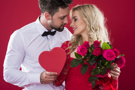 Romantic scene on the red background Фото со стока