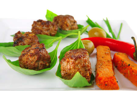 grilled pork: beef small cutlets with basil and hot chilli pepper