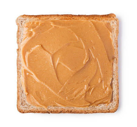 peanut butter on a slice of toast isolated on a white background