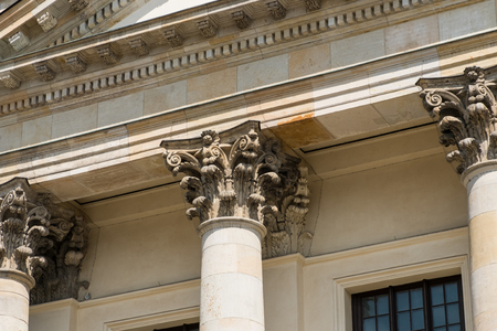 two pillars columns and capitals on historic architecture stock