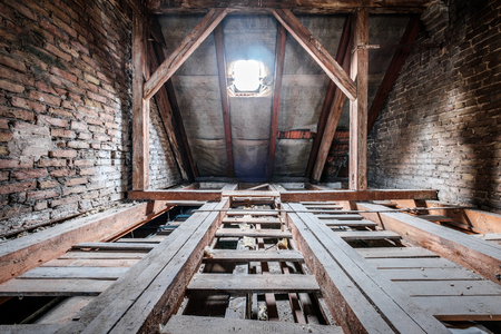 Floor beams in empty attic / loft of an old building roof Stock Photo