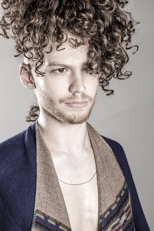 Attractive Young Man With Long Ginger Curly Hair Posing With