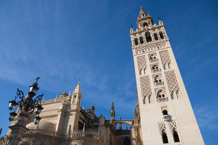 Gothic style cathedral in the city of seville in spain. you can see its bell tower known as the giralda. it is the largest catholic religious building in the world. tourism and travel concept.