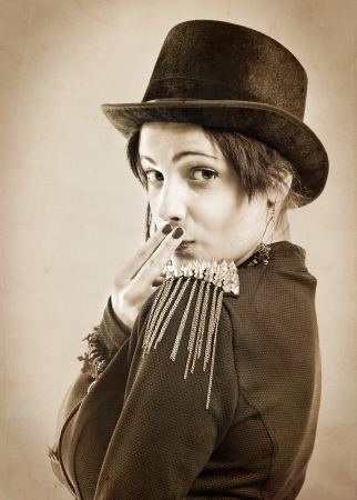 The actress of a cabaret imitates Charlie Chaplin,sepia