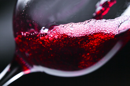 Red wine in wineglass on dark ФоÑо Ñо ÑÑока - 44184784