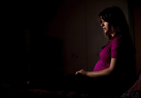 sad lonely: Pensive young pregnant woman
