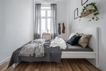 New Bedroom With Simple Bed Clothes Rack And Wall Shelf