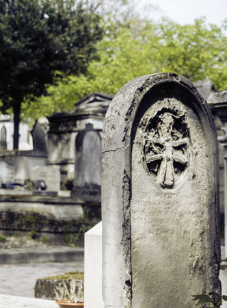 Tombstones in cemetery at dusk gothic style crosses noone around Imagens