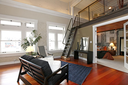 Modern living room with brick painted wall, hardwood floor and ... Modern nappali fal