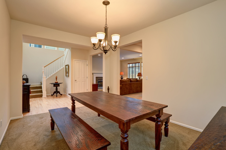 Open Floor Plan View Of Dining Room With Carved Wooden Table Living And Open Floor Plan View Of Dining Room With Carved Wooden Table Living And