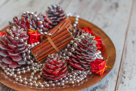 christmas decorations of colored cones sticks beads on a copper tray on a light gray - Copper Christmas Decorations christmas decorations of colored cones sticks beads on a copper tray on a light gray - Copper Christmas Decorations