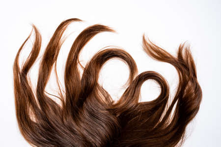 Hair waves curls lie on a white background