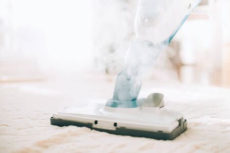 Cleaning the floor with steam cleaner. banner and copy space. cleaning service concept.