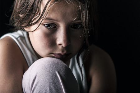 sad lonely: Powerful Shot of Sad Child