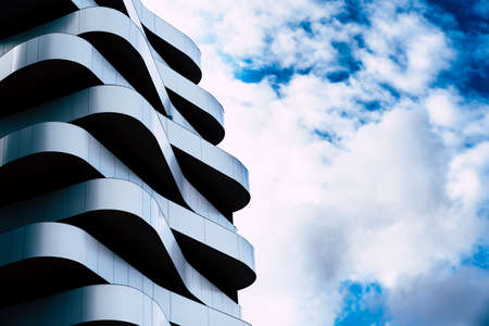 Residential building with a futuristic and minimalist design with a white facade.