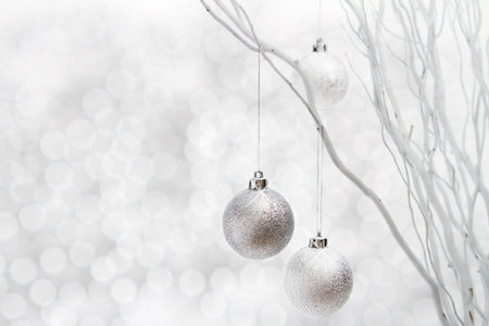 christmas background of silver ball decorations on white sparkle christmas background white
