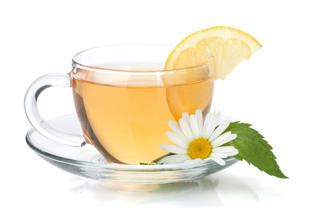 Cup of tea with lemon slice, mint leaves and chamomile flower. Isolated on white background